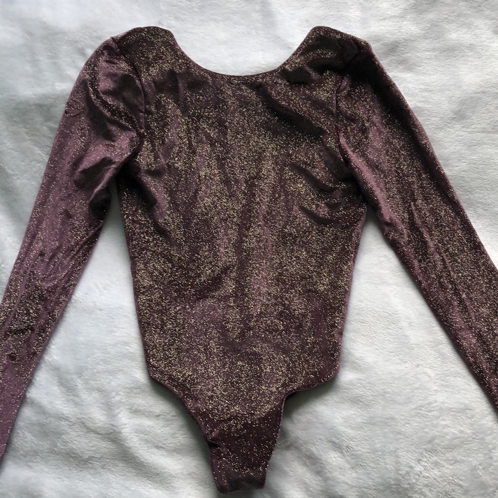 New with tags, Victoria’s Secret purple sparkly body suit, size xs
